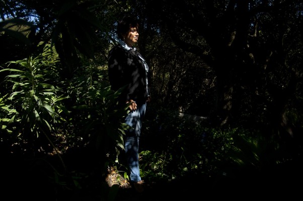 Shweta Narayan poses for a photo in a patch of woods near the office of Global Community Monitor in El Cerrito. Narayan works with disenfranchised communities in India and helps residents there monitor industries for pollution. (Photo by: Tyler Orsburn)